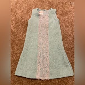 Sleeveless dress with rose ruffle design